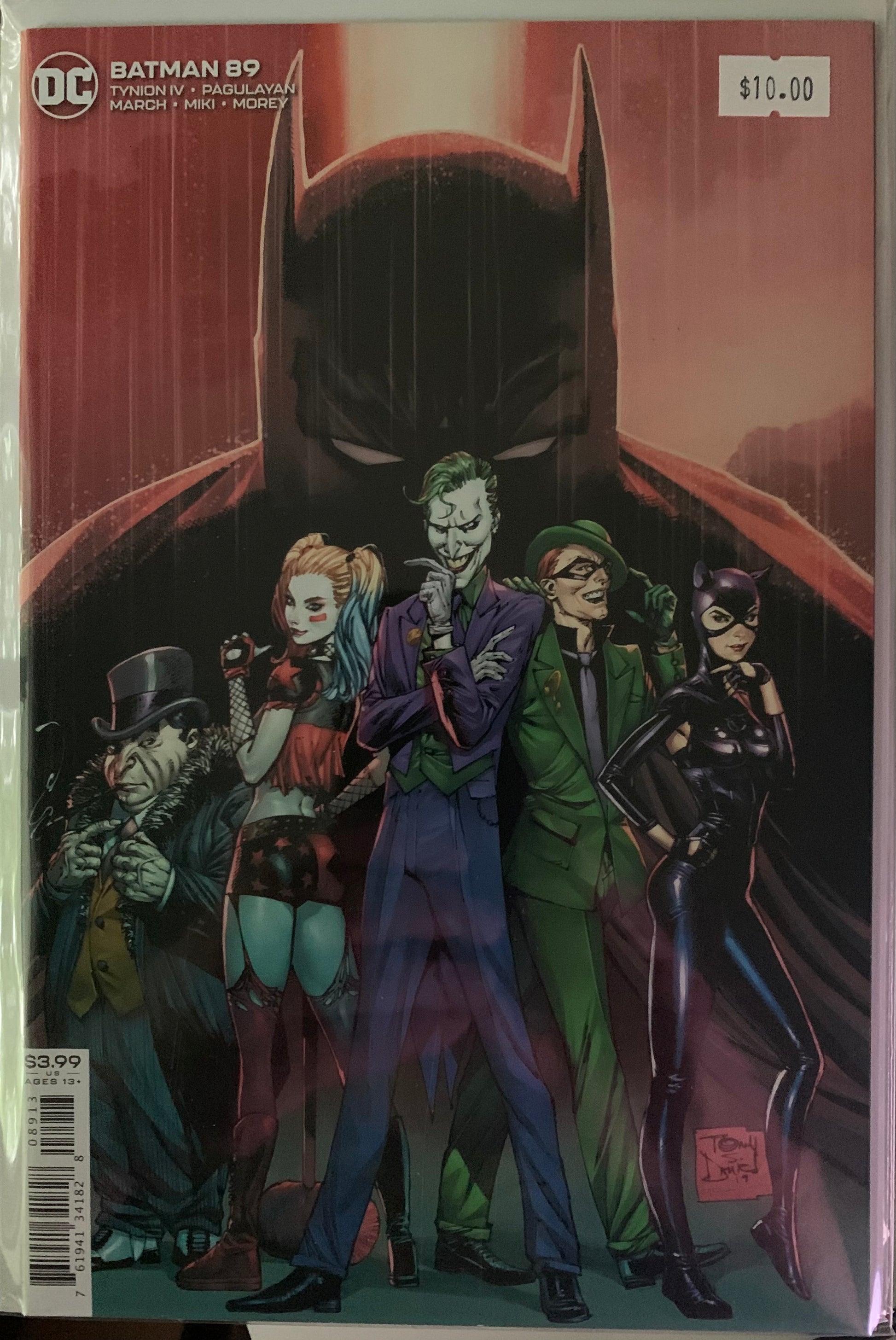 Comic book cover featuring Batman and his rogue's gallery with a red background