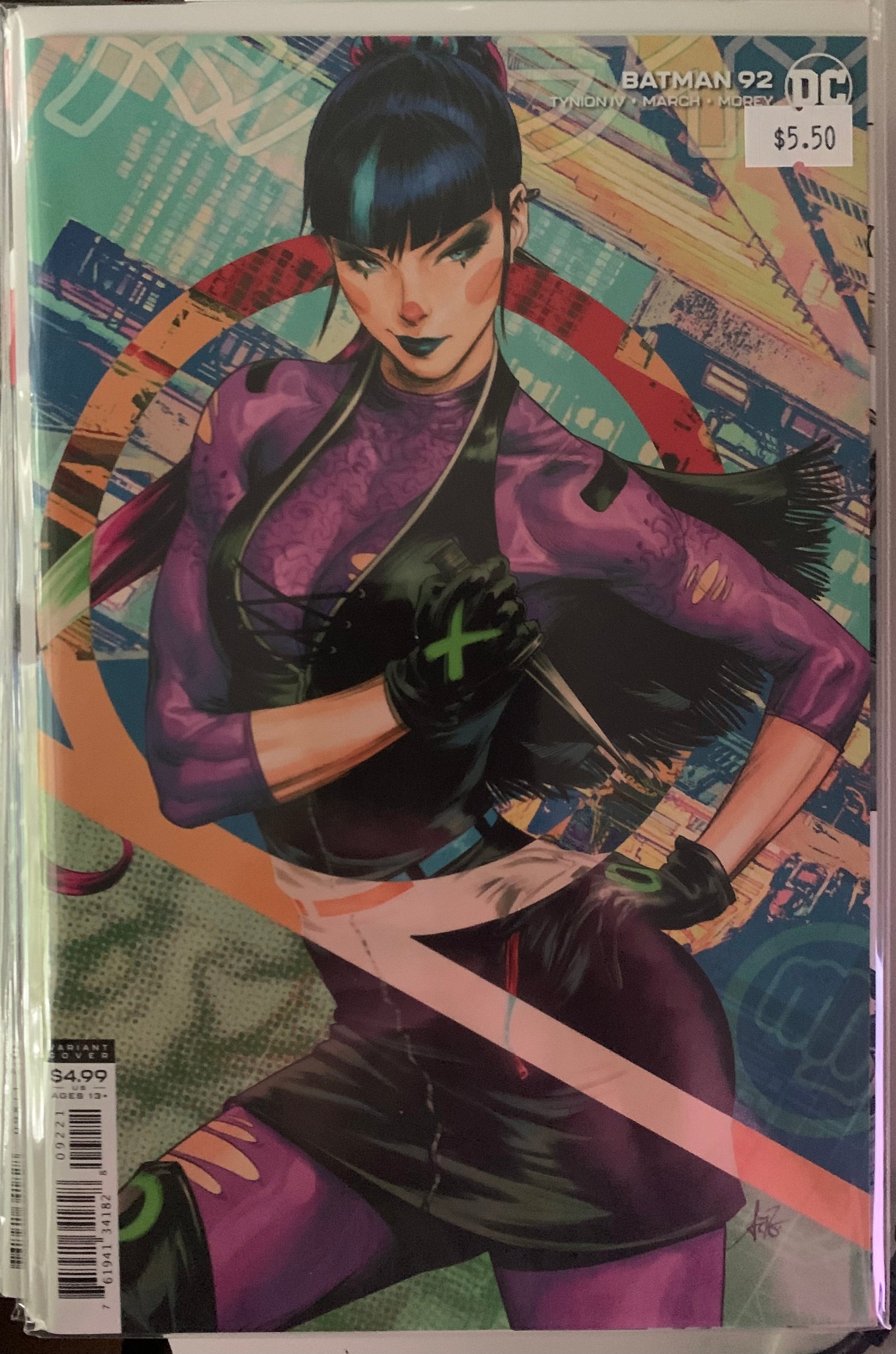 Comic book cover featuring Punchline in a purple outfit with a colorful background