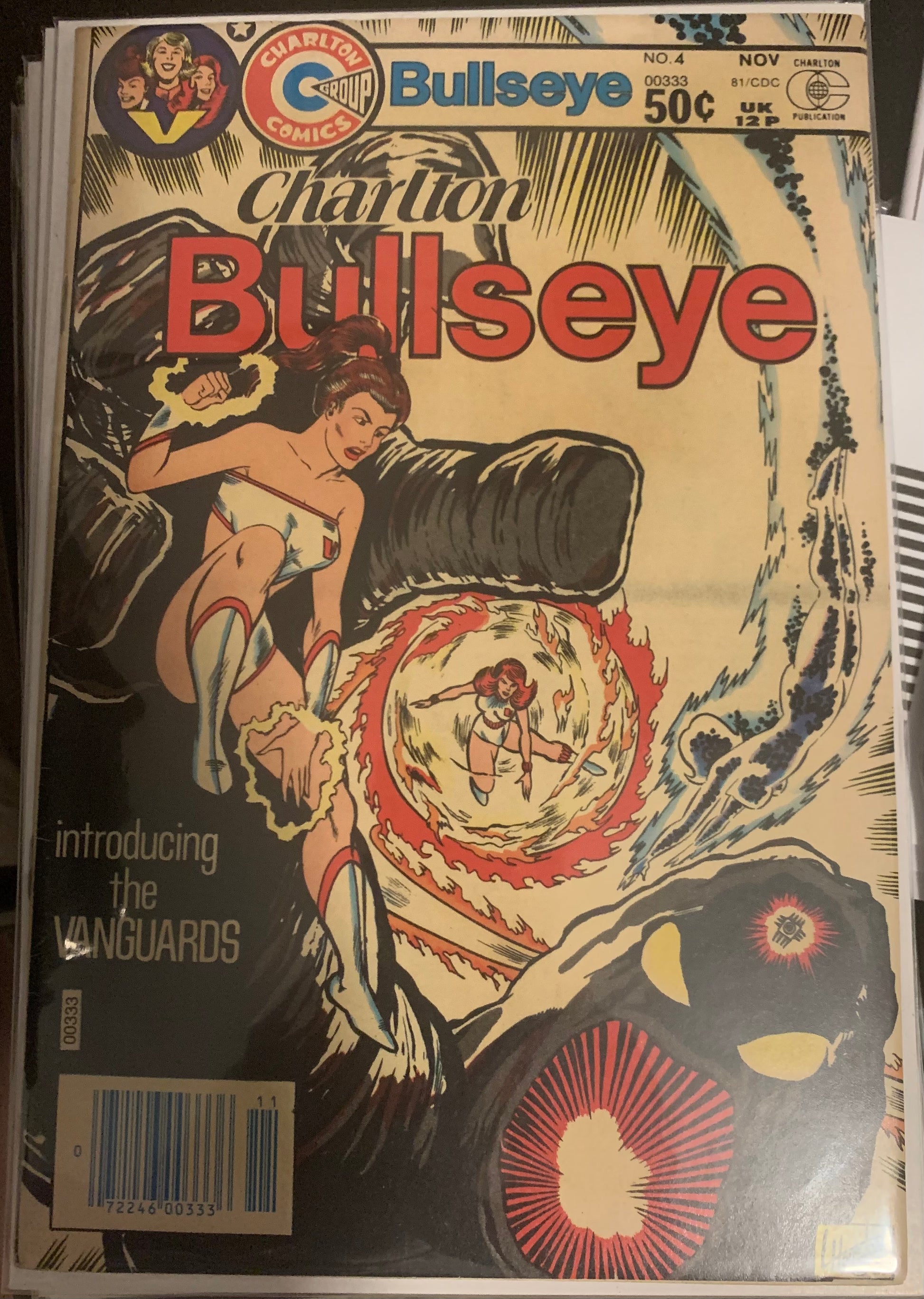 Vintage Charlton Bullseye comic book cover with a woman and vortex graphic and a gigantic creature. Introducing the Vanguards.