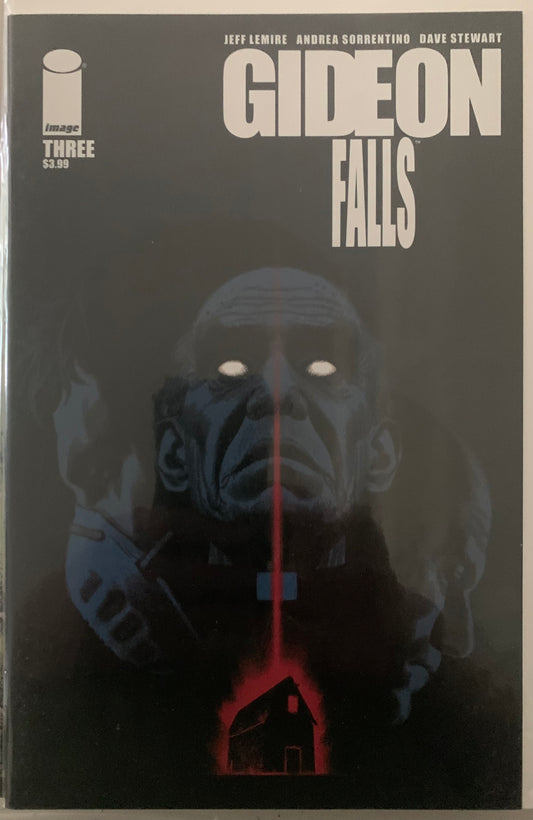 Comic book cover of 'Gideon Falls' with a dark background and a figure of a priest with glowing eyes over a ominous glowing red barn.