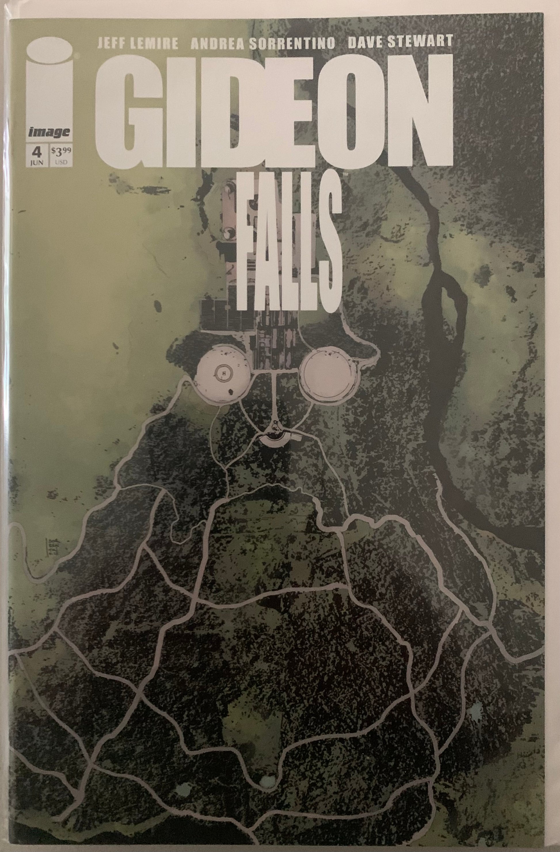 Comic book cover of 'Gideon Falls' with a map-like design in the shape of a face.