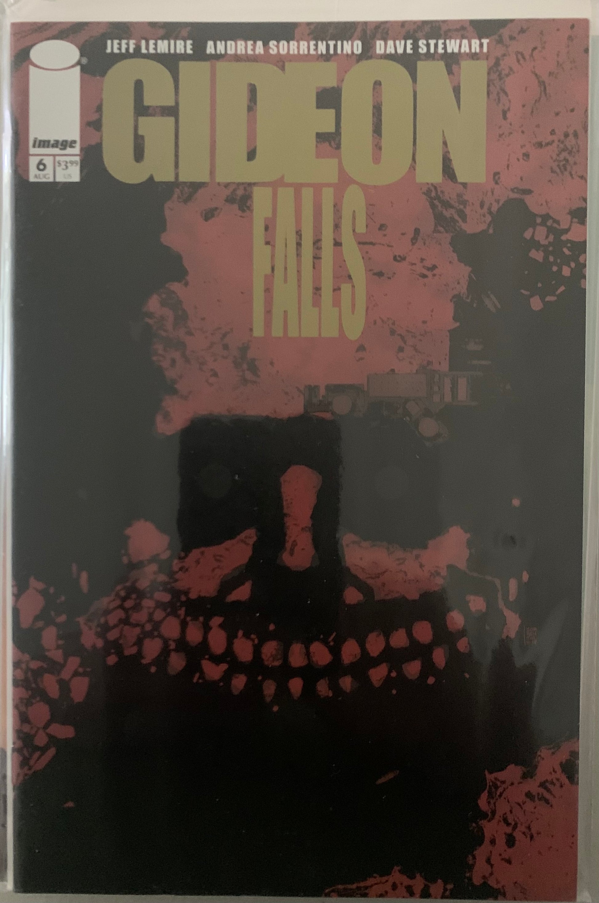 Comic book cover of 'Gideon Falls' with a stylized face made of rocks and text.