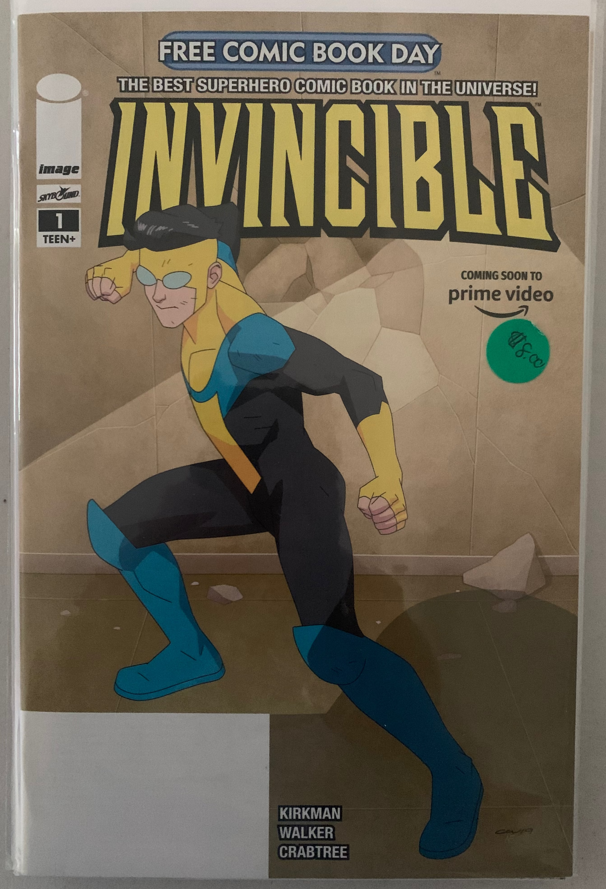 Comic book cover of 'Invincible' with superhero character on a brown background