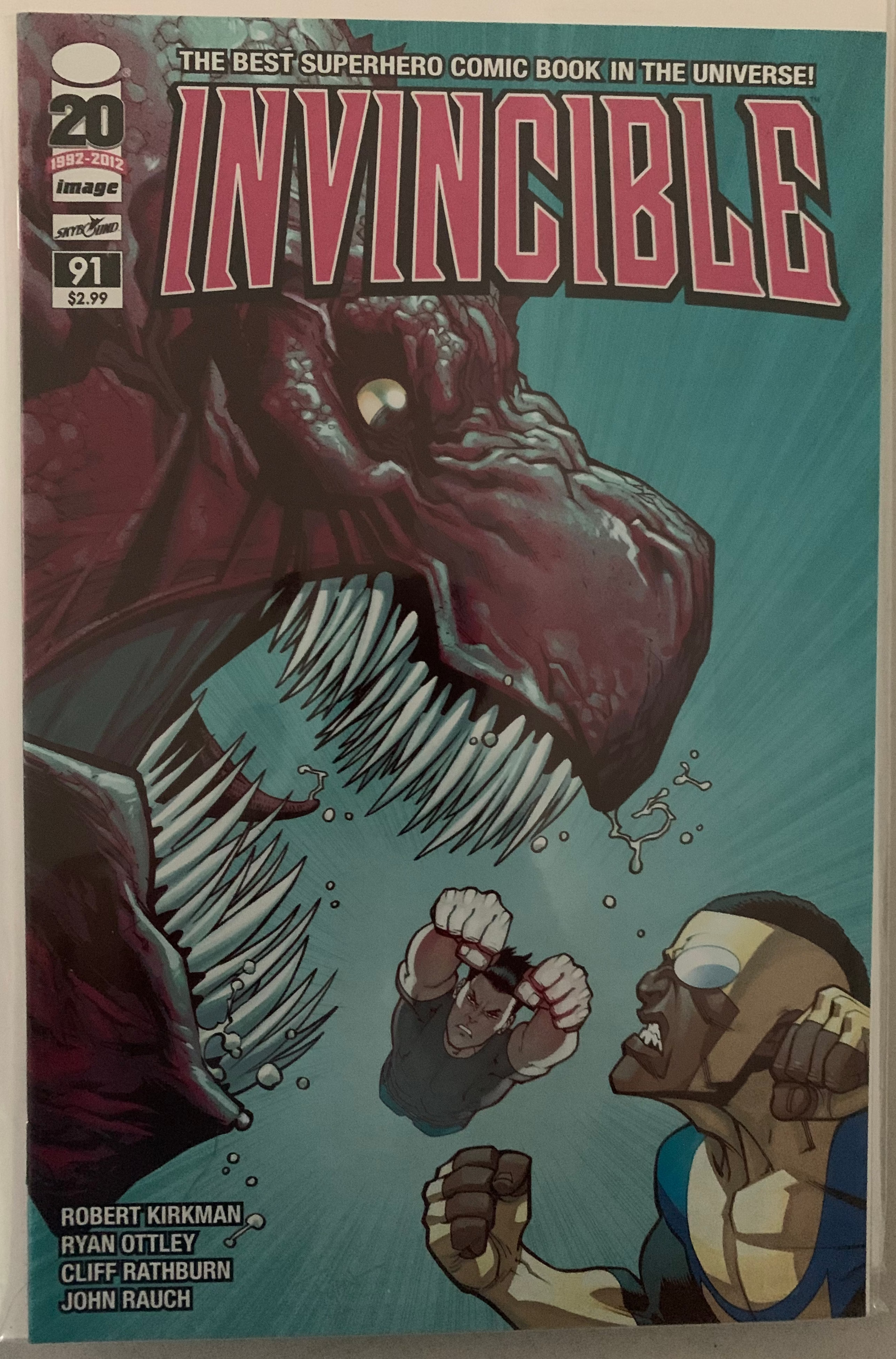 Comic book cover of 'Invincible' with a dramatic scene and title text.