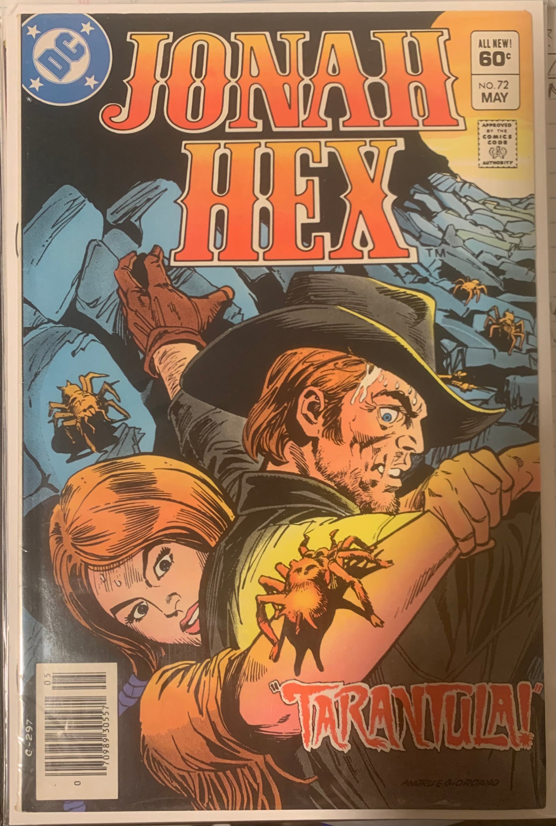 Vintage Comic book cover featuring 'Jonah Hex' with a man and woman in a mountainous landscape with tarantulas.