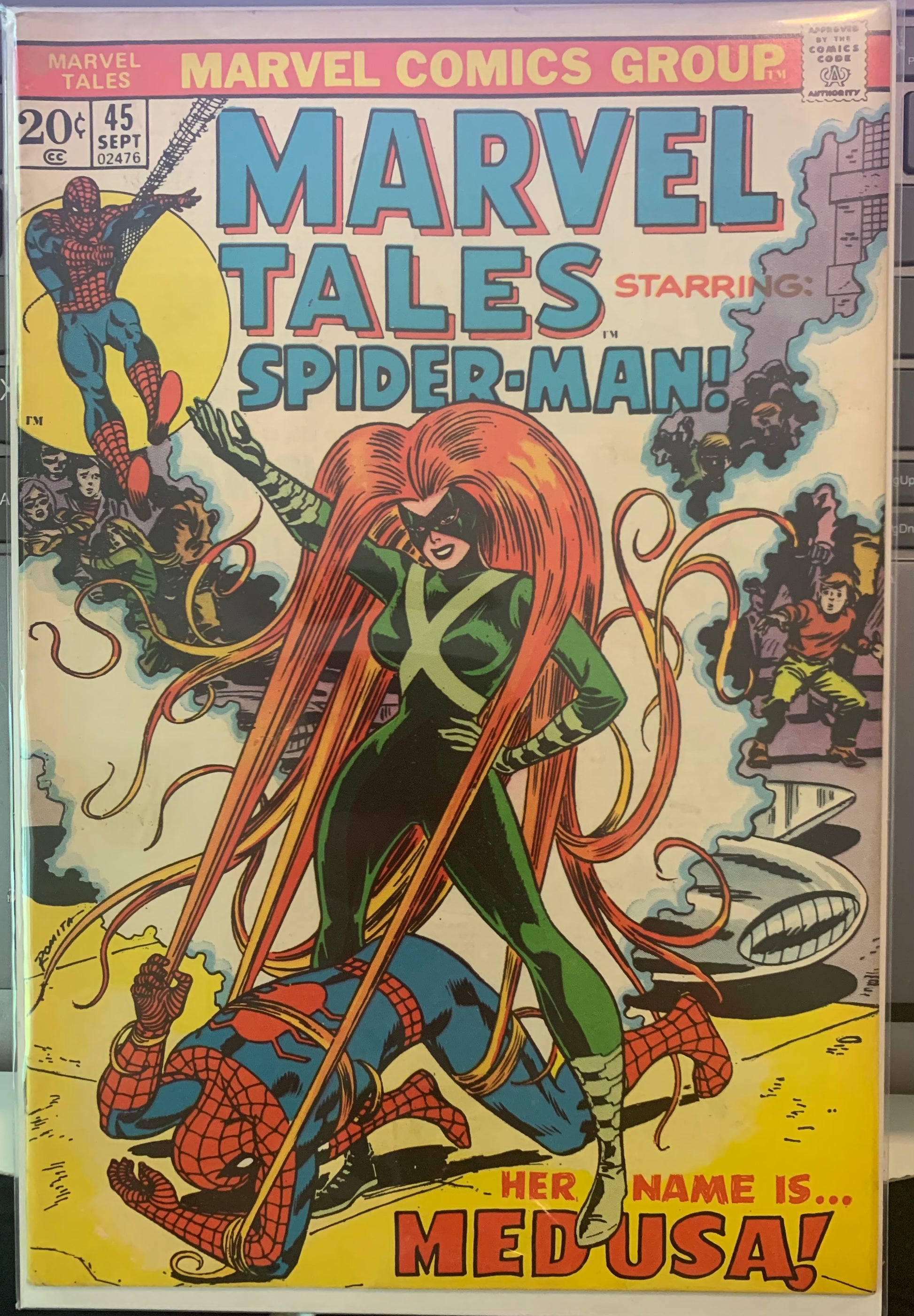Vintage Comic book cover featuring Spider-Man and Medusa with Marvel Comics Group branding.