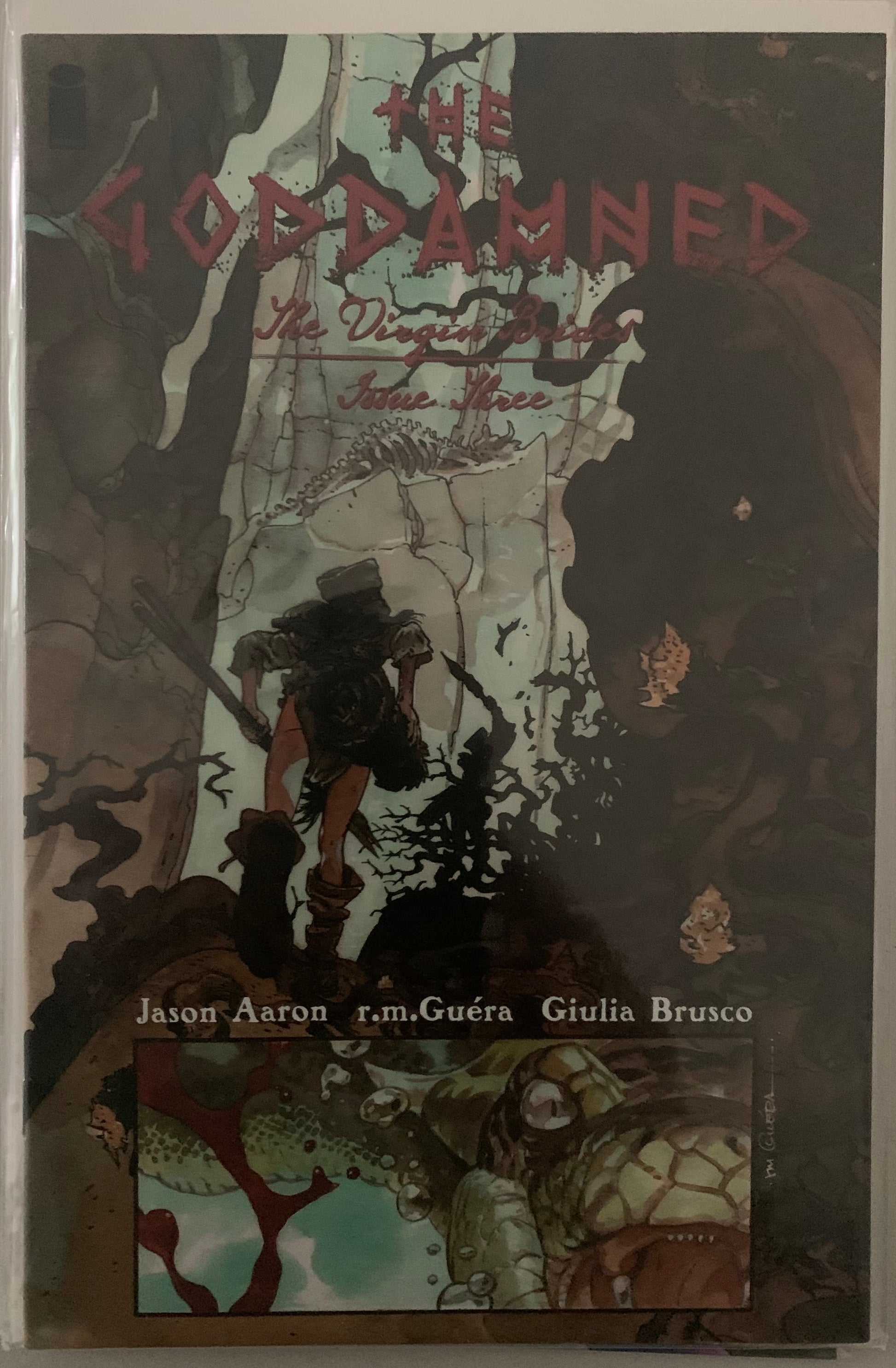 Comic book cover titled 'The Goddamned' with a female character with a spear walking through a canyon.