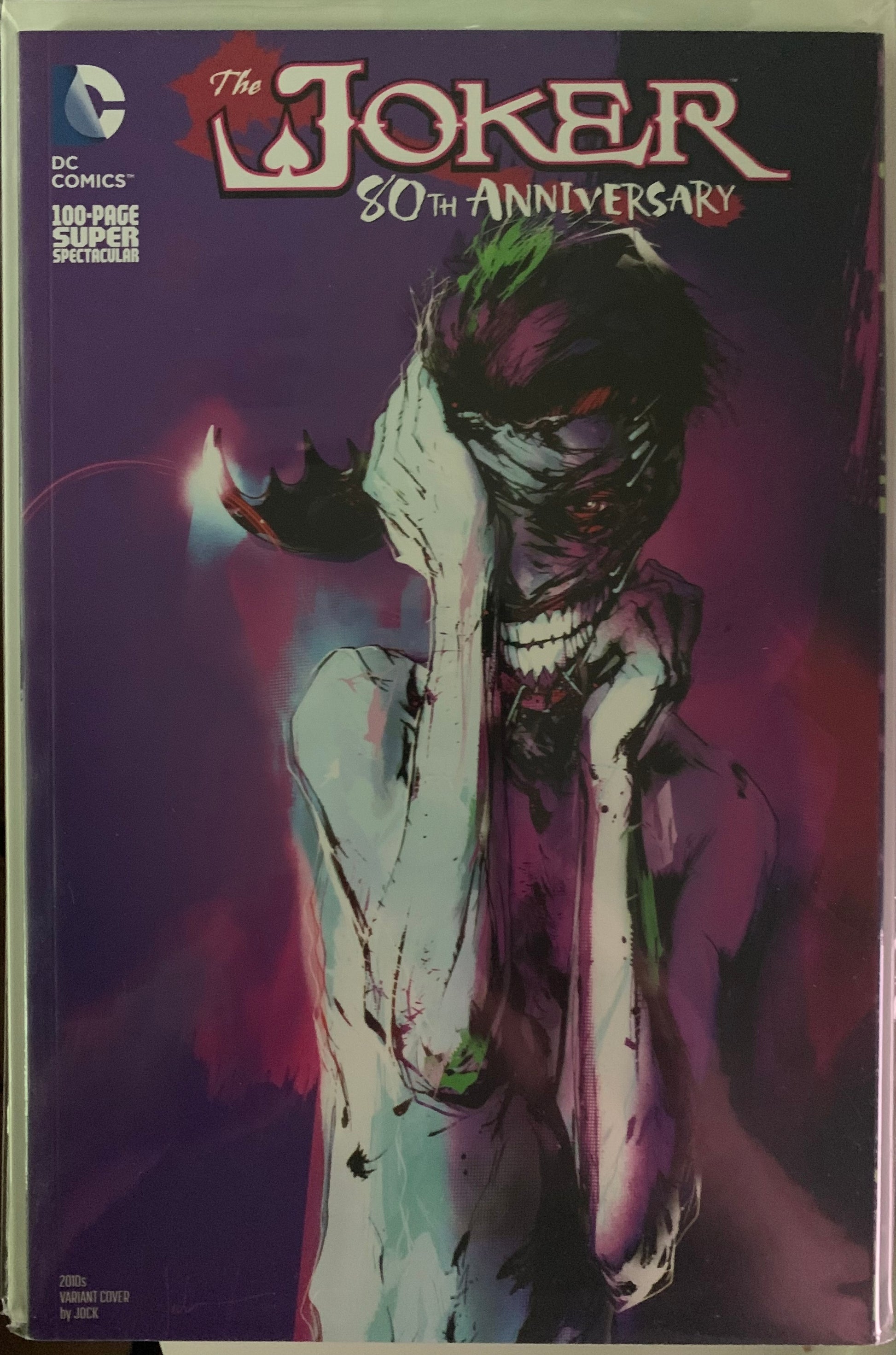 Comic book cover featuring The Joker with a dark purple background
