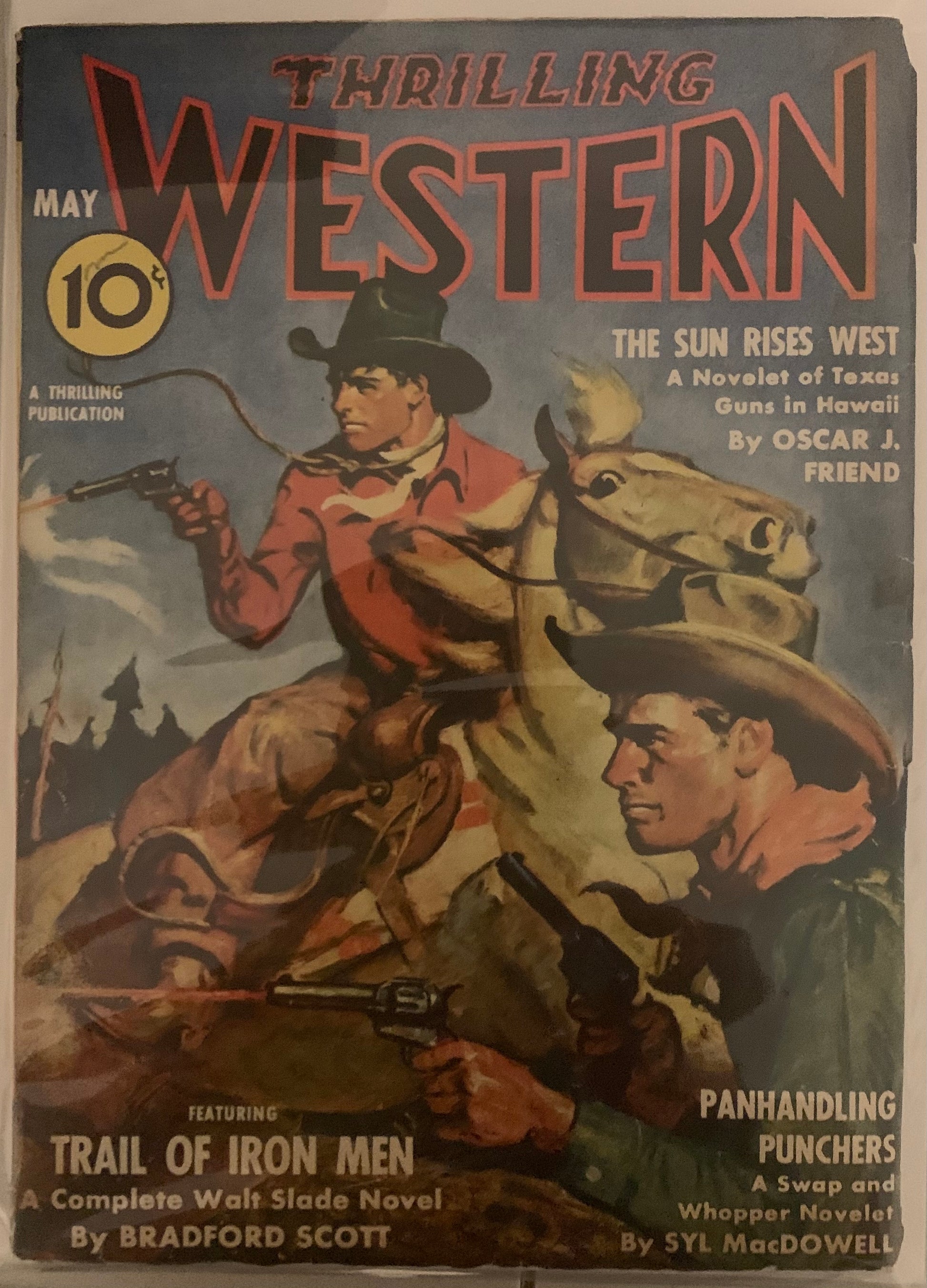 Vintage Western comic book cover with two cowboys, one on horseback, and text about thrilling Western stories from May, 1942.