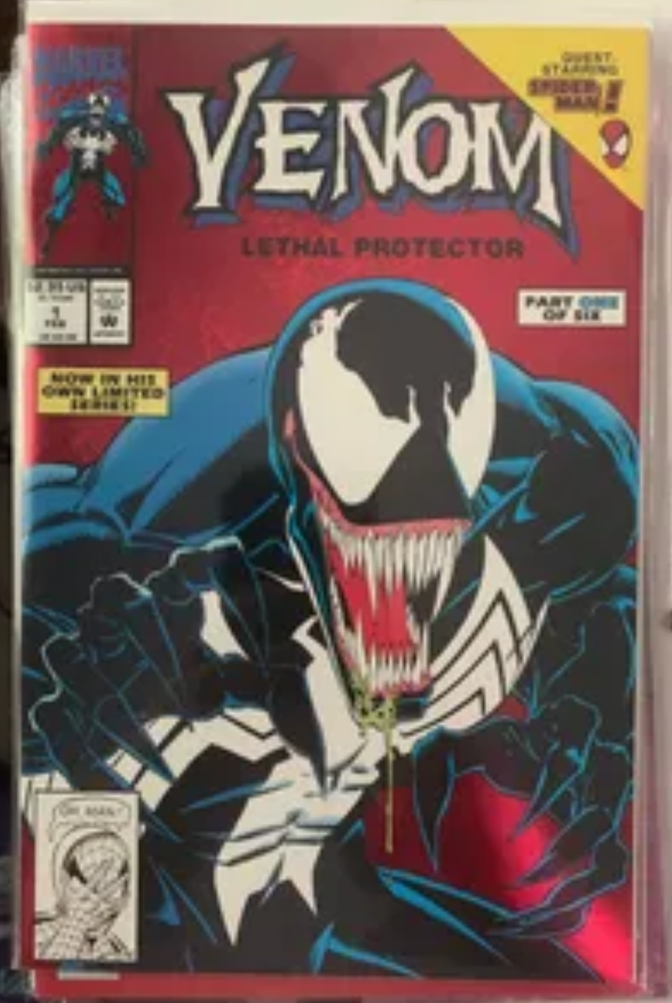 Comic book cover featuring Venom with a red and blue color scheme.