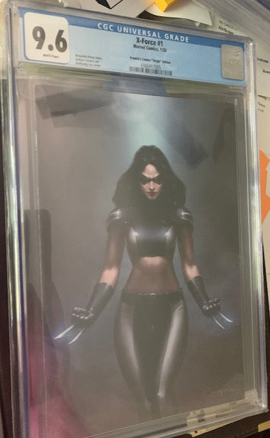 Graded Comic book cover in a protective case with a CGC grading label and X-23 with her claws out.
