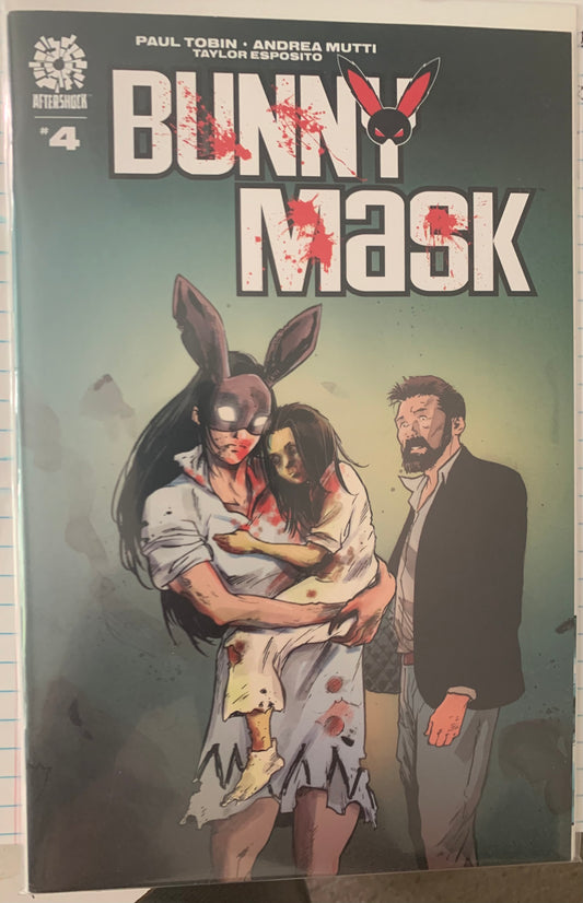 Comic book cover titled 'Bunny Mask' with a woman in a bunny mask holding a injured girl, both covered with spots of blood, and a man standing near them.