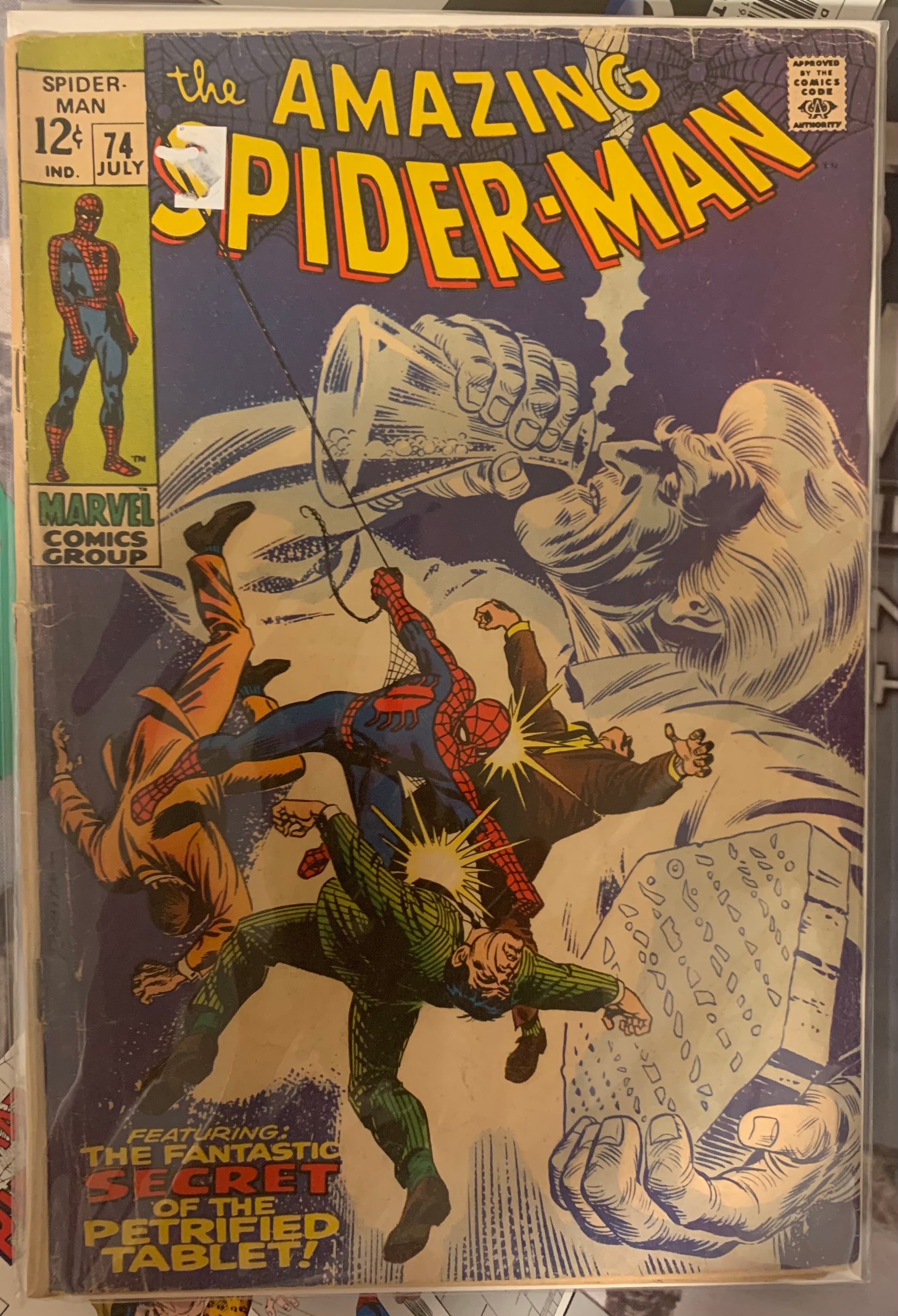 Comic book cover featuring Spider-Man and a large creature, with text and Marvel logo.