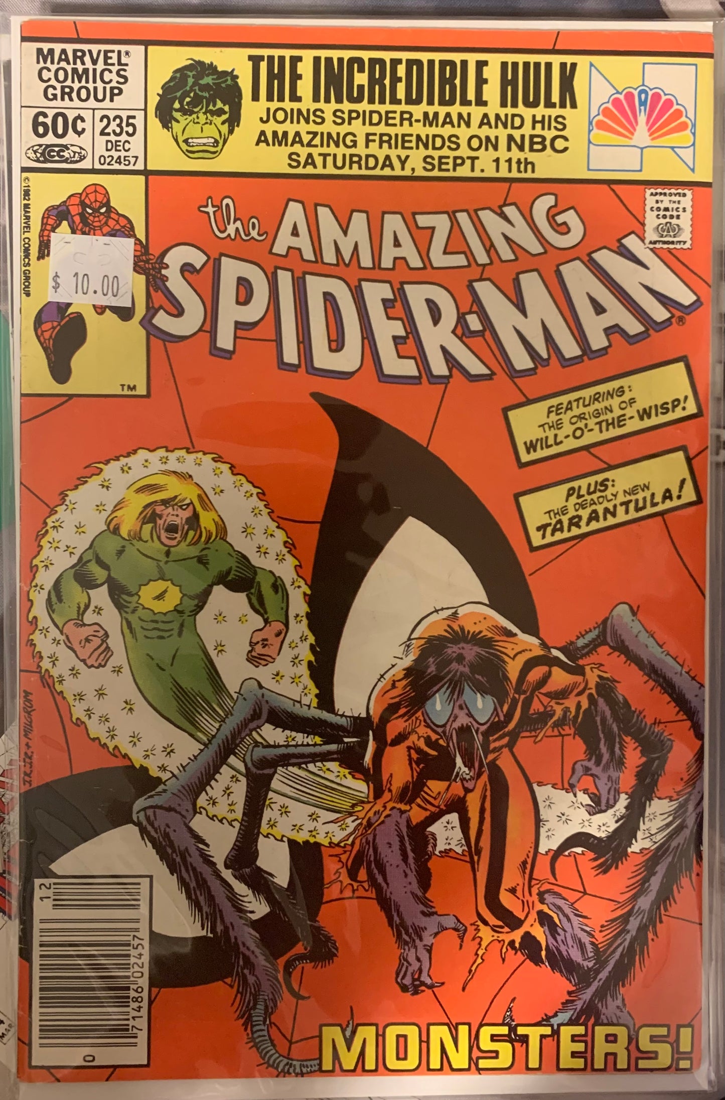 Comic book cover featuring The Amazing Spider-Man and a monster, with Marvel Comics branding.