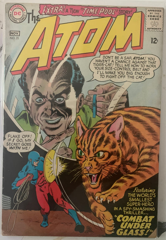 Vintage Comic book cover featuring 'The Atom' with a tiger-cat and a villain.