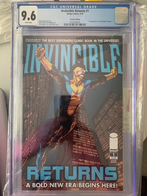 Graded Comic book titled 'Invincible Returns' with CGC grading label and Invincible flying across a skyscraper background
