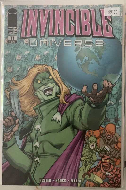 Comic book cover of 'Invincible Universe' featuring a green supervillain holding a globe.