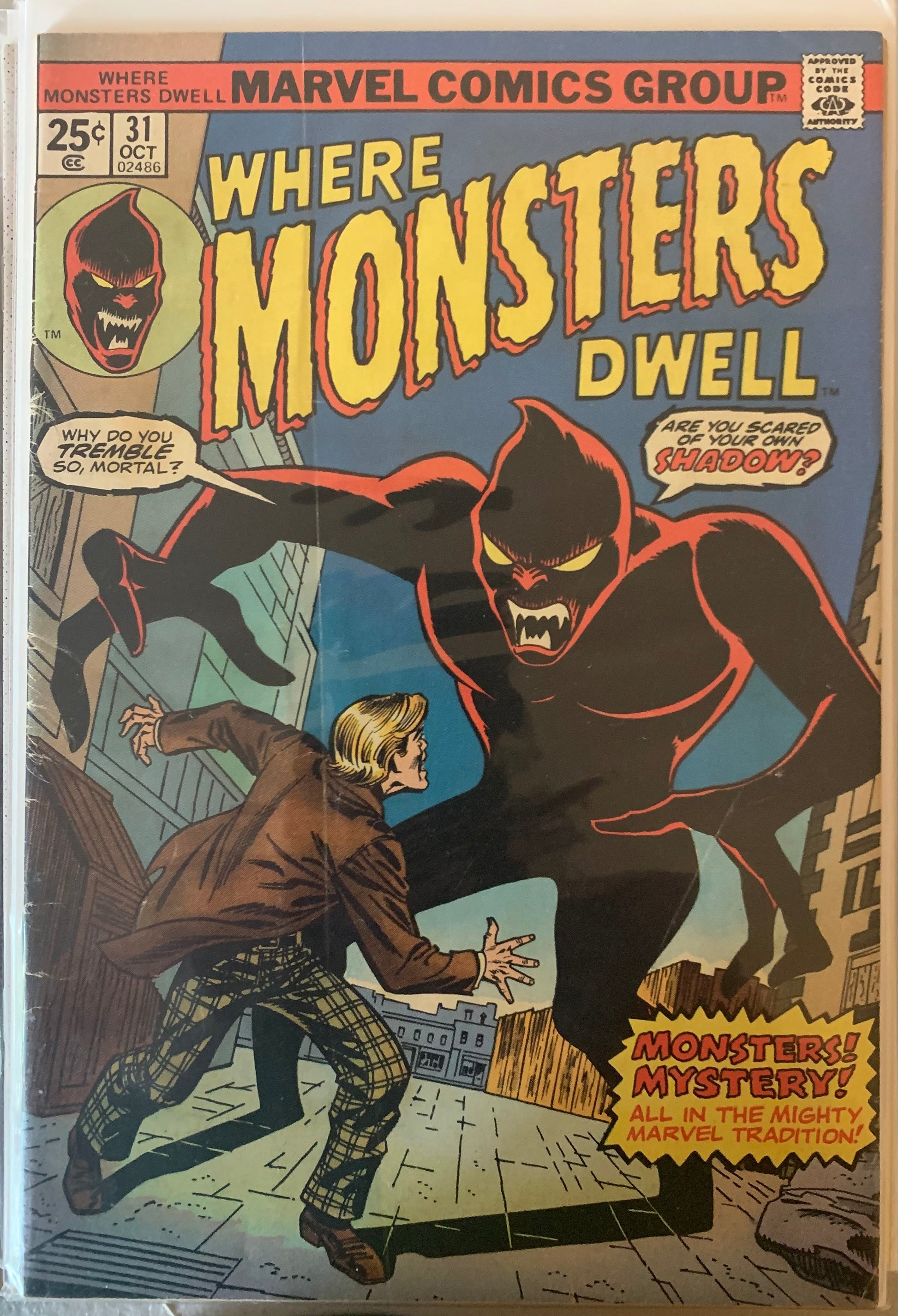 Comic book cover featuring a monster and a person, with 'Marvel Comics Group' branding.